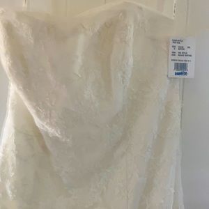 White wedding dress, size 10, strapless with the front short than the back.